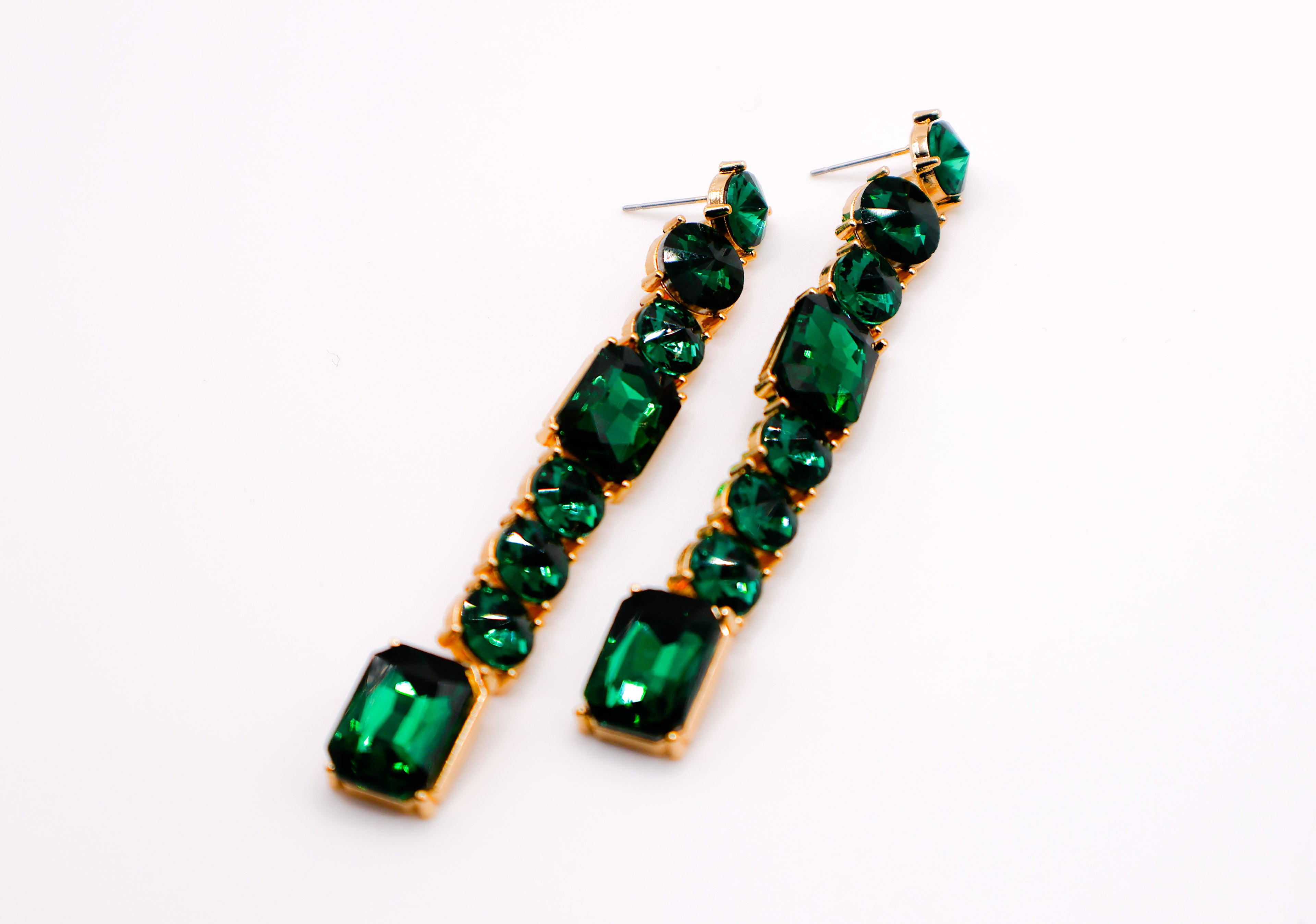 Le Réussi® Emerald Cascade Earrings – luxury green faux diamond statement earrings for women, elegant gemstone-inspired jewelry for special occasions.