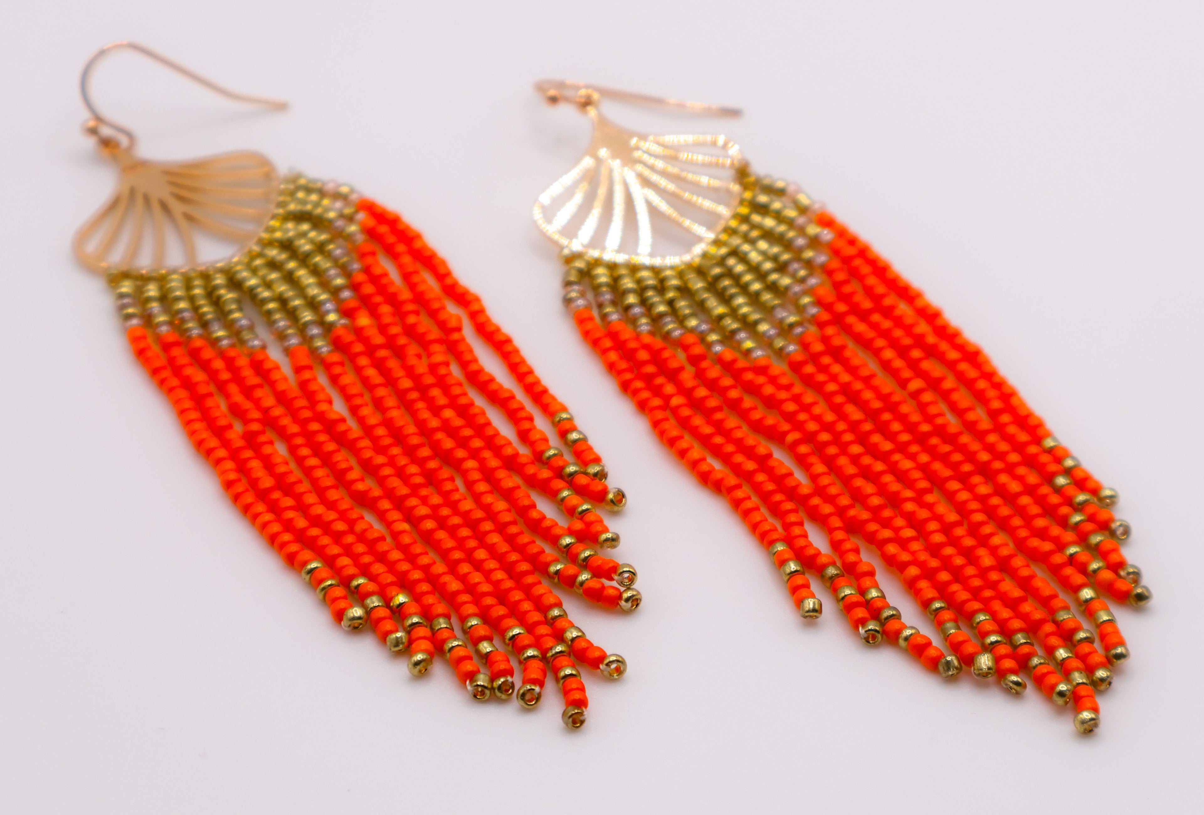 Le Réussi® Golden Leaves Earrings – luxury gold leaf statement earrings with orange beads for women, elegant fashion jewelry for special occasions.