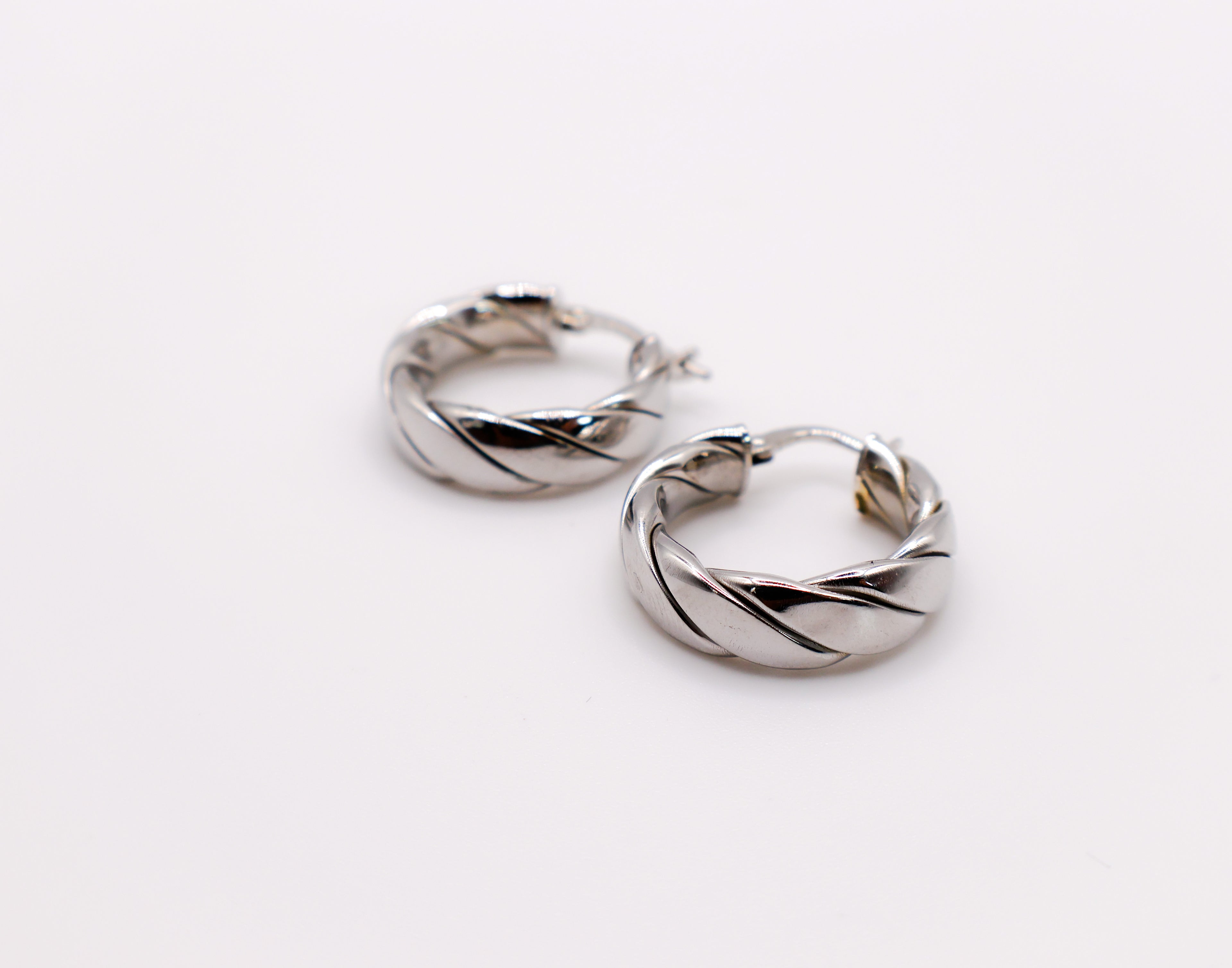 Elegant Italian twisted texture sterling silver hoop earrings for women.