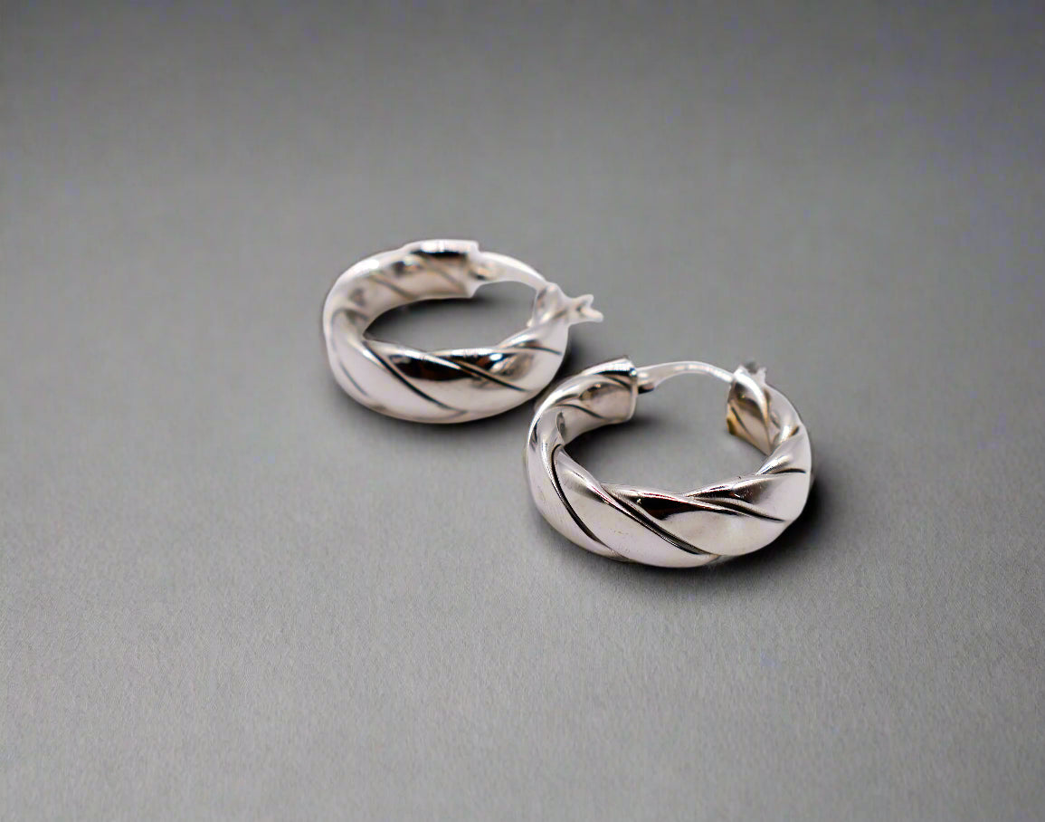 Italian Twirl Sterling Silver Hoop Earrings with a chic twisted design for timeless elegance.