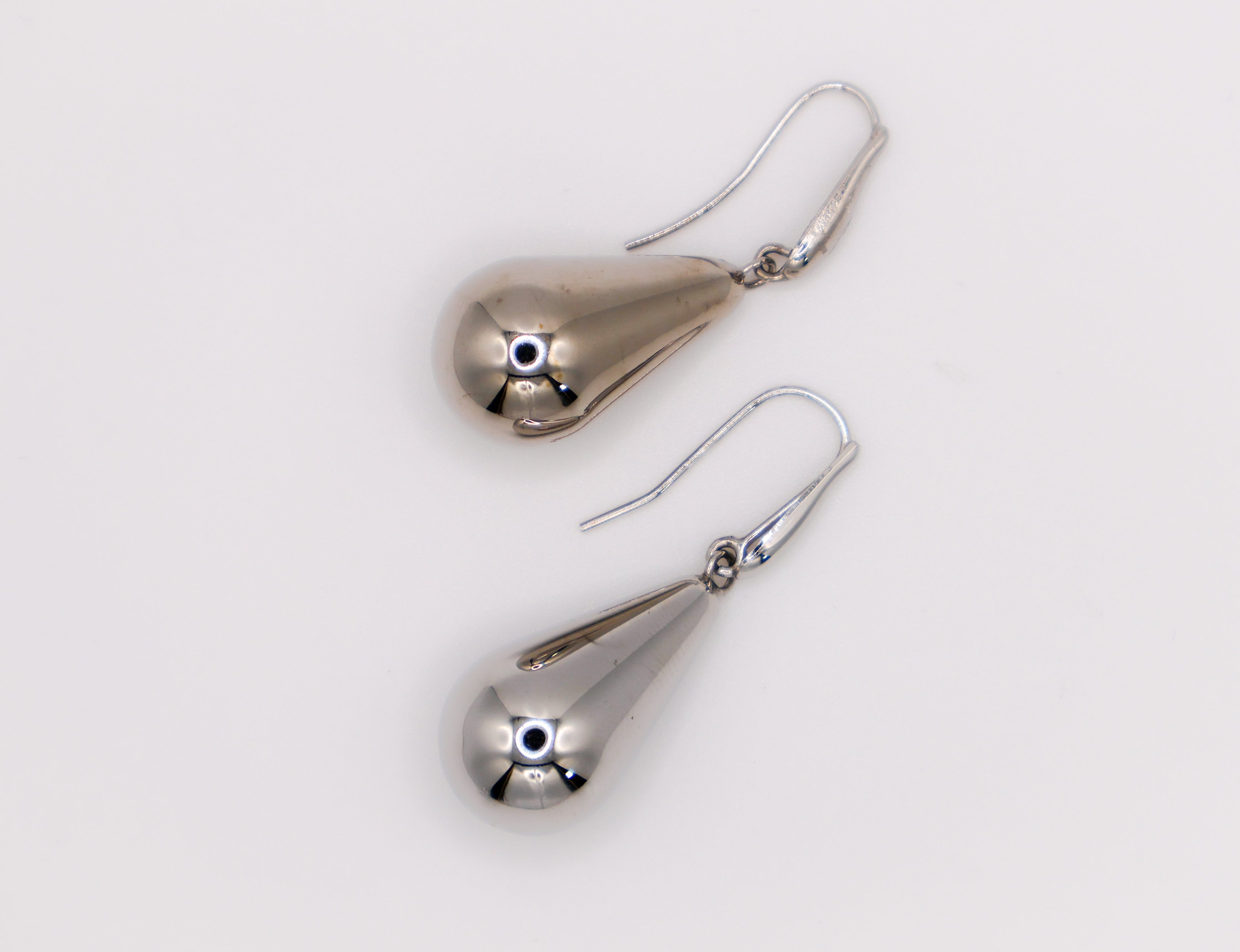 Sterling silver raindrop earrings with elegant dangling design for women.