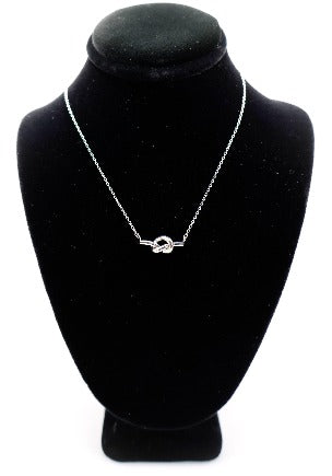 Le Réussi® Eternal Knot Silver Necklace – luxury silver pendant necklace for women, elegant fashion jewelry symbolizing timeless style.