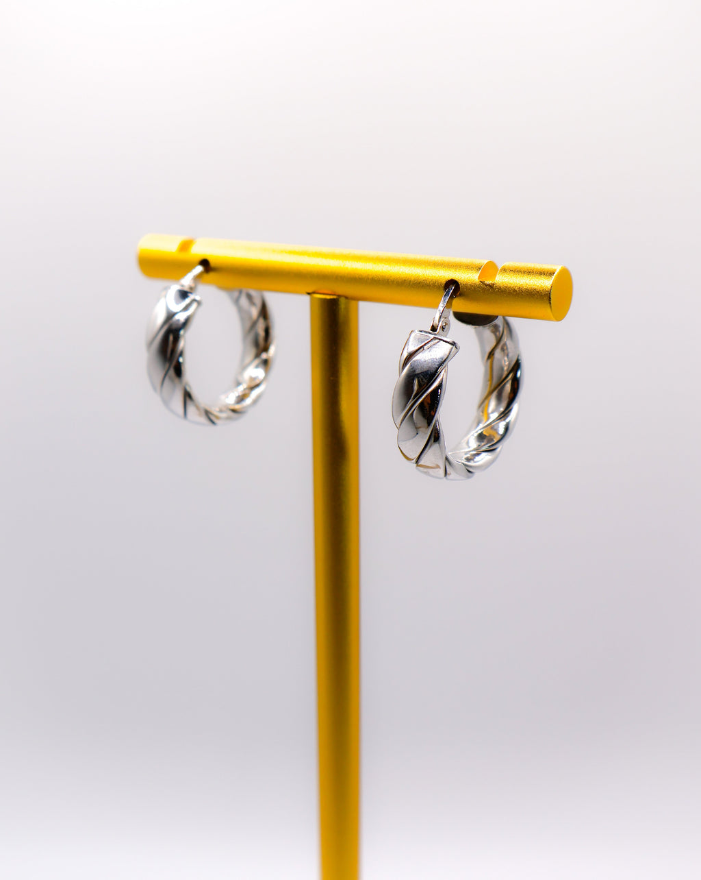 Italian Twirl Sterling Silver Hoop Earrings with a chic twisted design for timeless elegance.