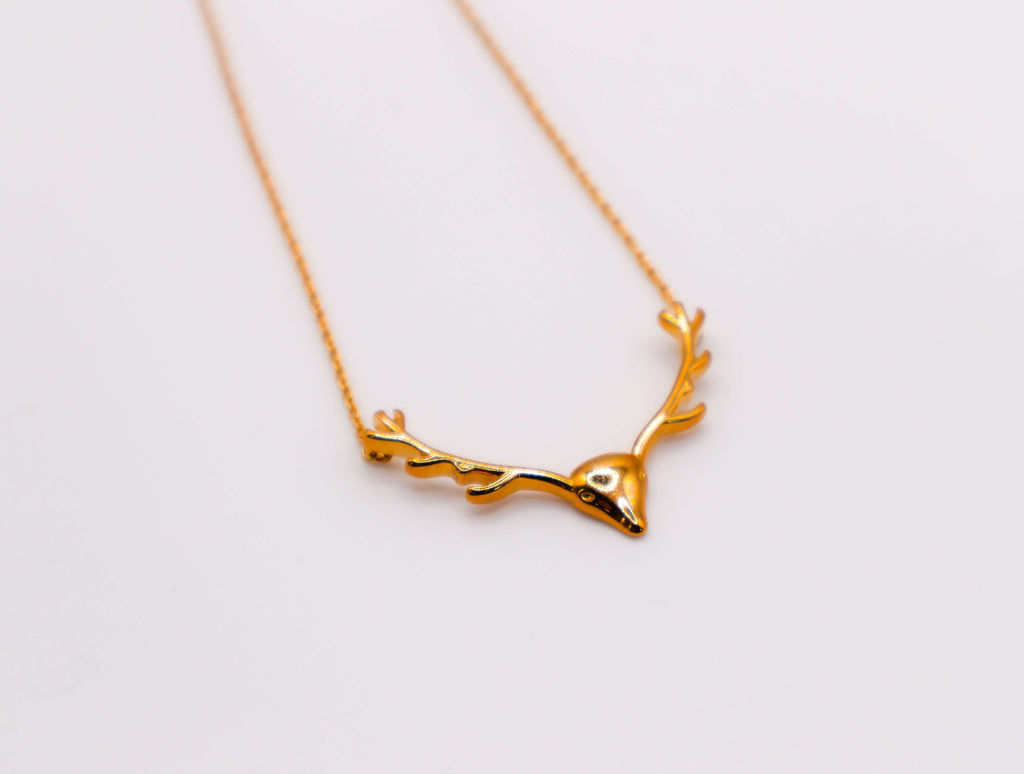 Le Réussi Golden Wilderness Antler Pendant in gold with nature-inspired design