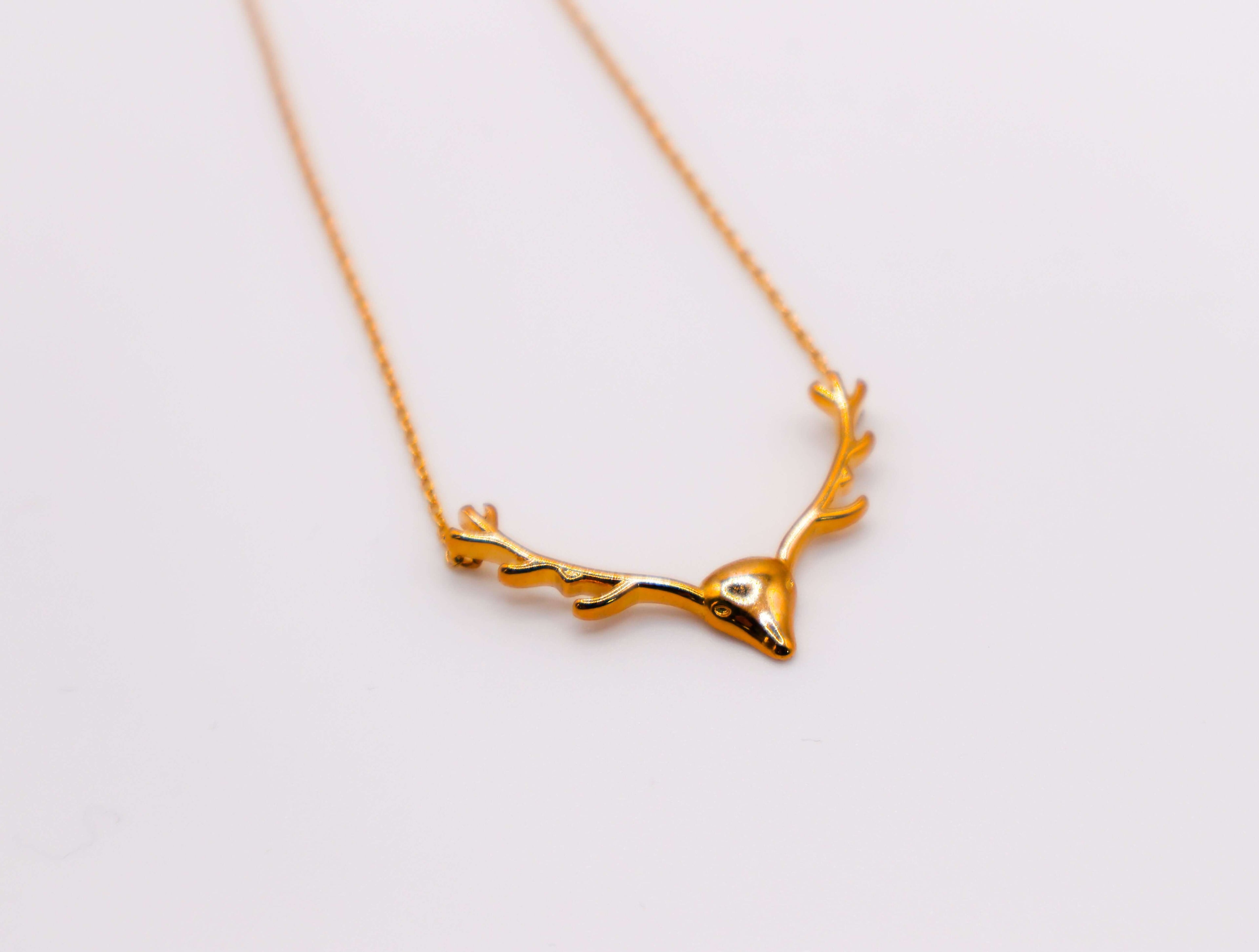 Le Réussi Golden Wilderness Antler Pendant in gold with nature-inspired design