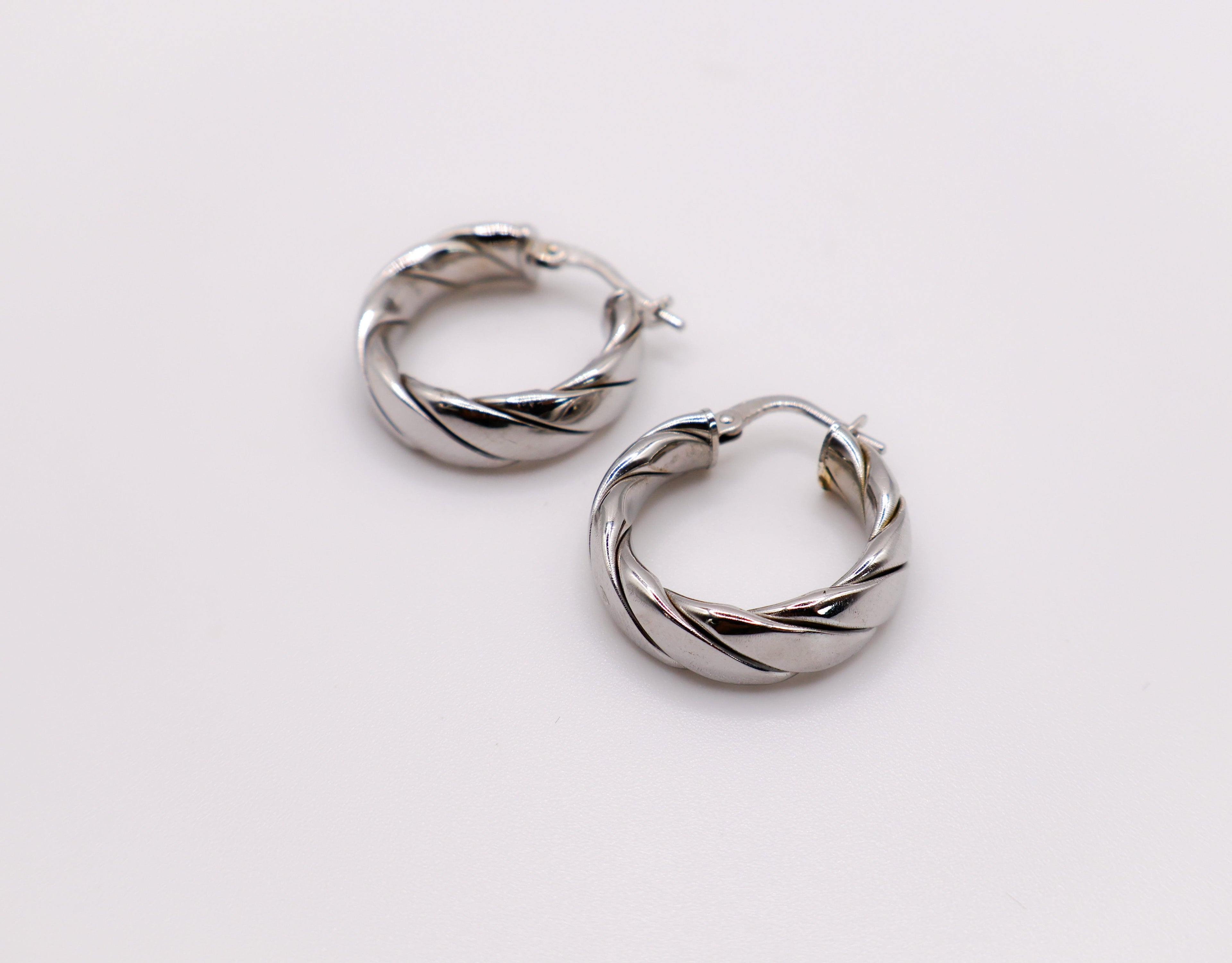 Elegant Italian twisted texture sterling silver hoop earrings for women.