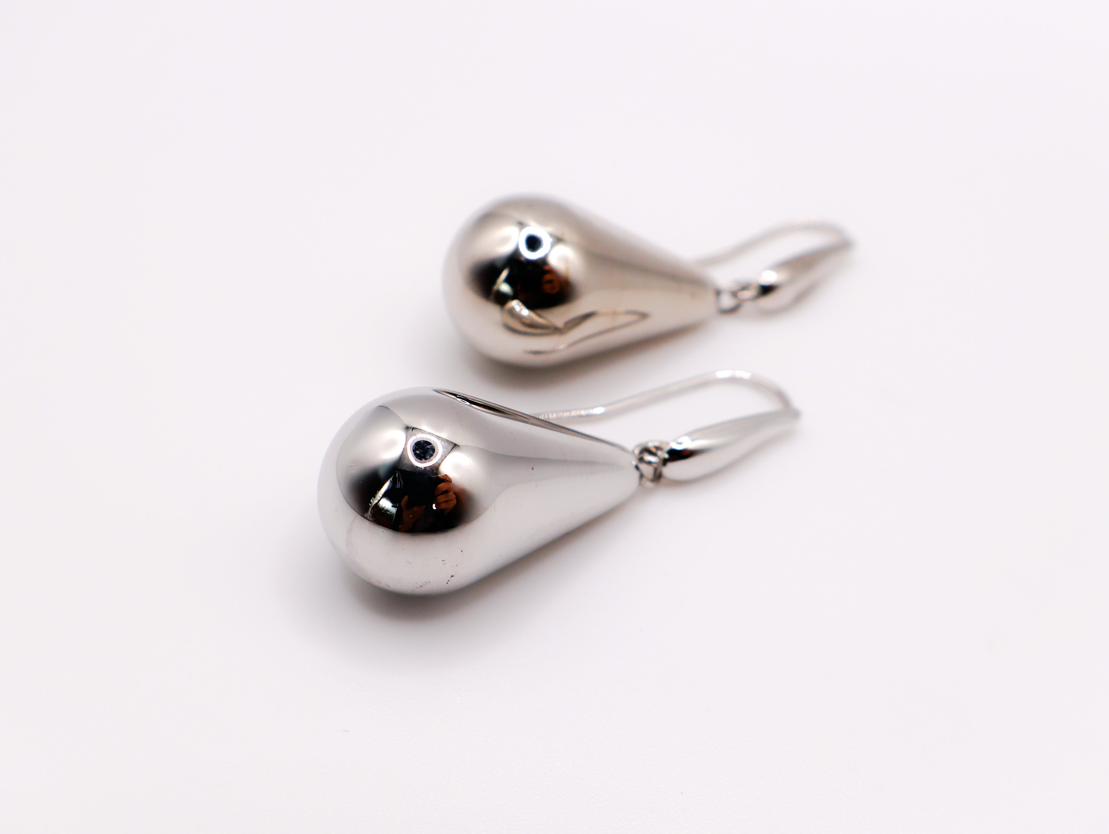 Sterling silver raindrop earrings with elegant dangling design for women.