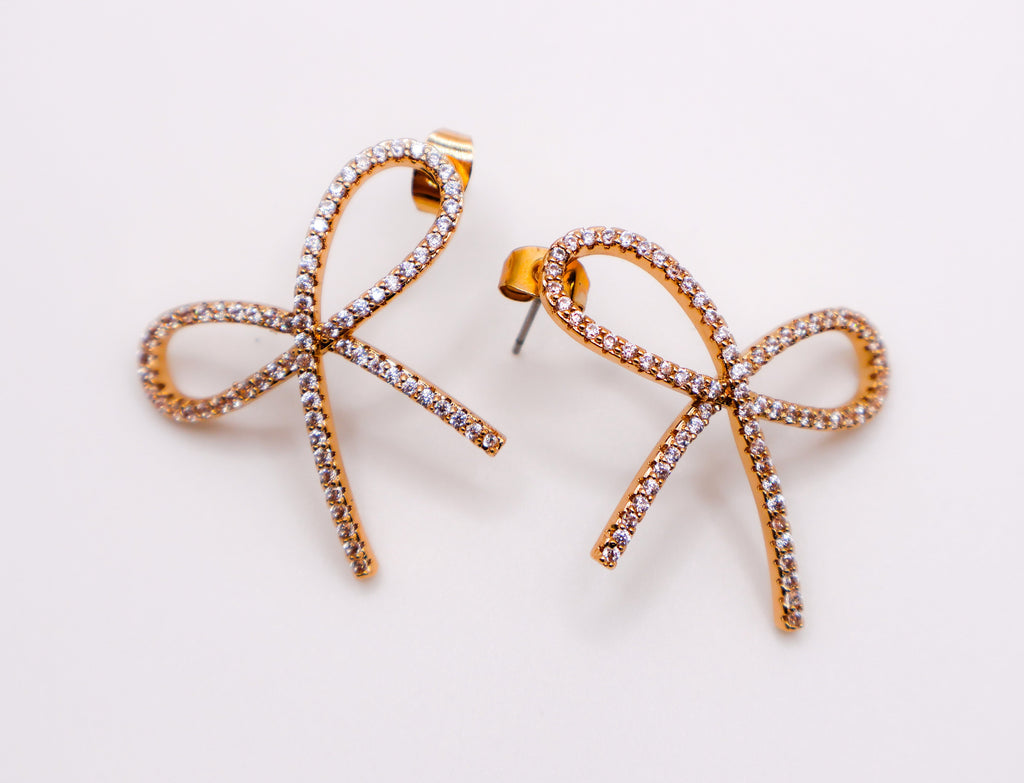 Le Réussi® Golden Bow Tie Sparkle Earrings with shimmering gold bow design