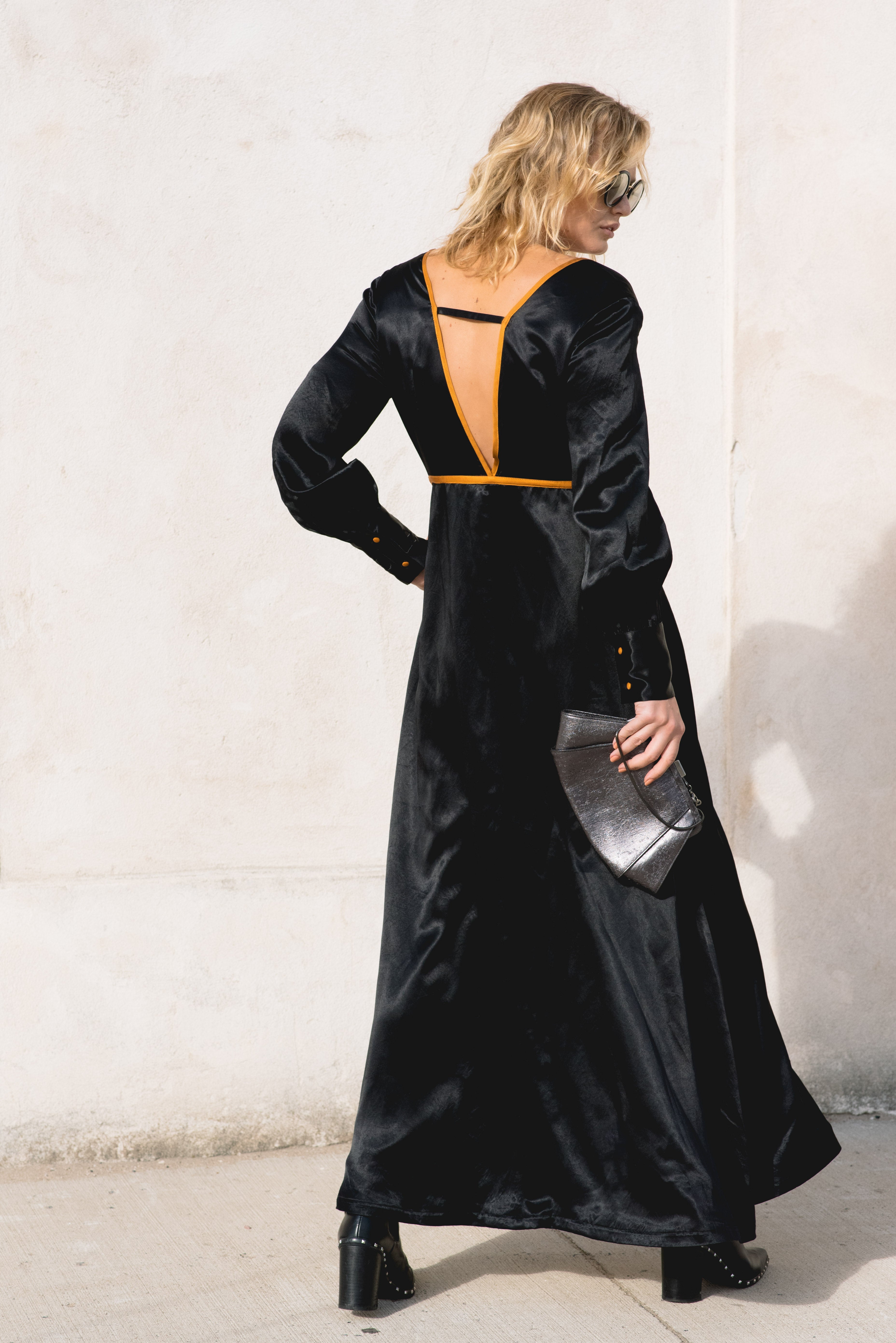 Le reussi Fashion-Adrienne Black Crafted from premium silk and adorned with elegant orange line details,this style dress features a sophisticated v-neck and long sleeves.
