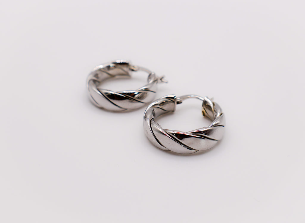 Italian Twirl Sterling Silver Hoop Earrings with a chic twisted design for timeless elegance.