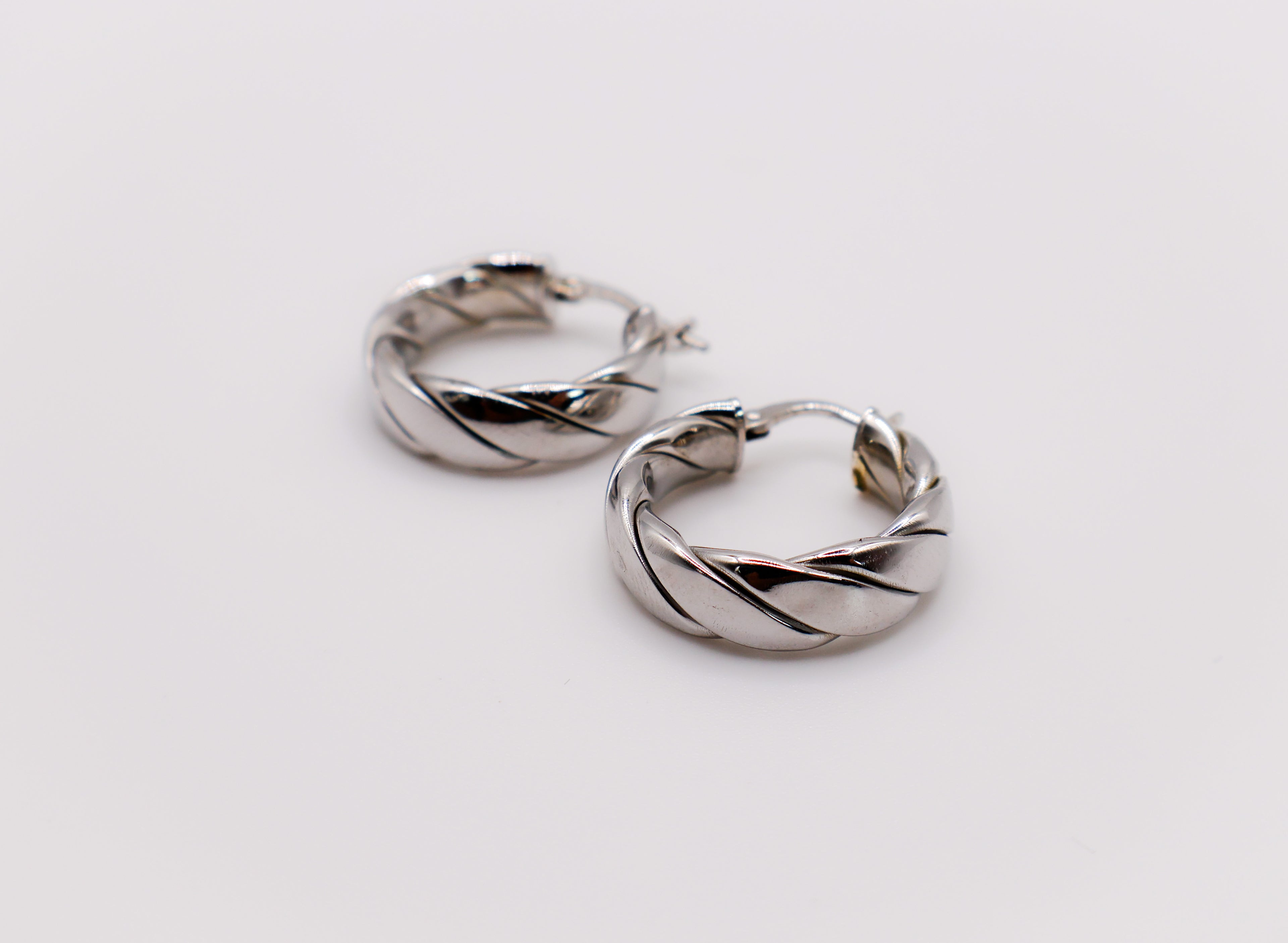 Italian Twirl Sterling Silver Hoop Earrings with a chic twisted design for timeless elegance.