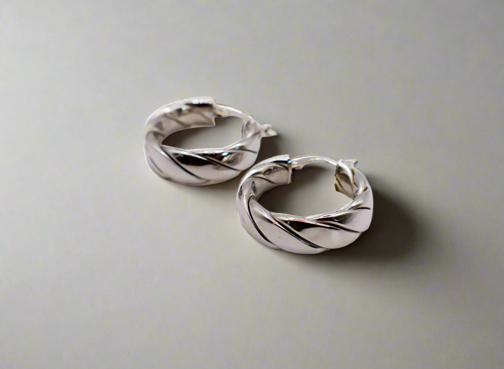 Elegant Italian twisted texture sterling silver hoop earrings for women.