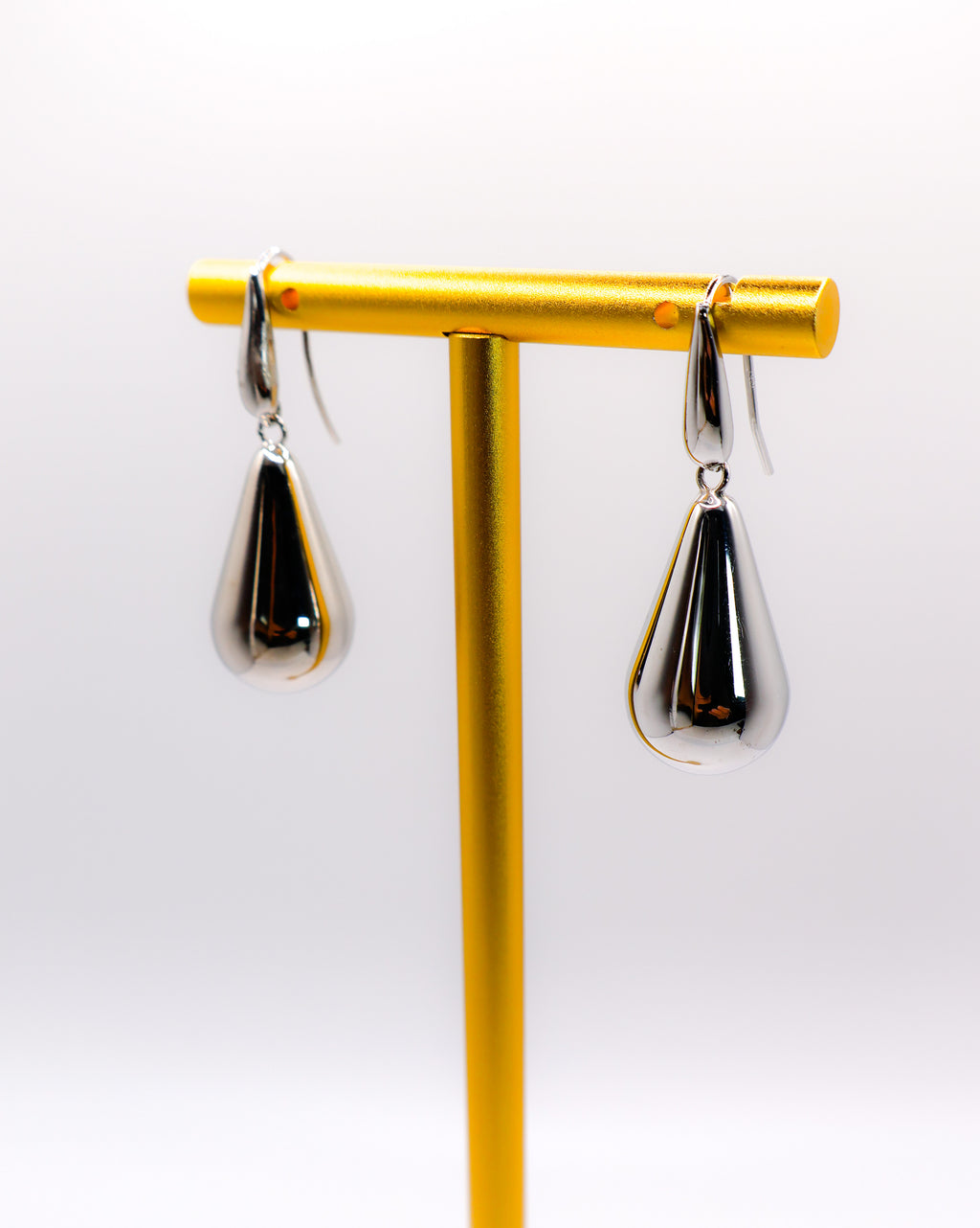 Sterling silver raindrop earrings with elegant dangling design for women.