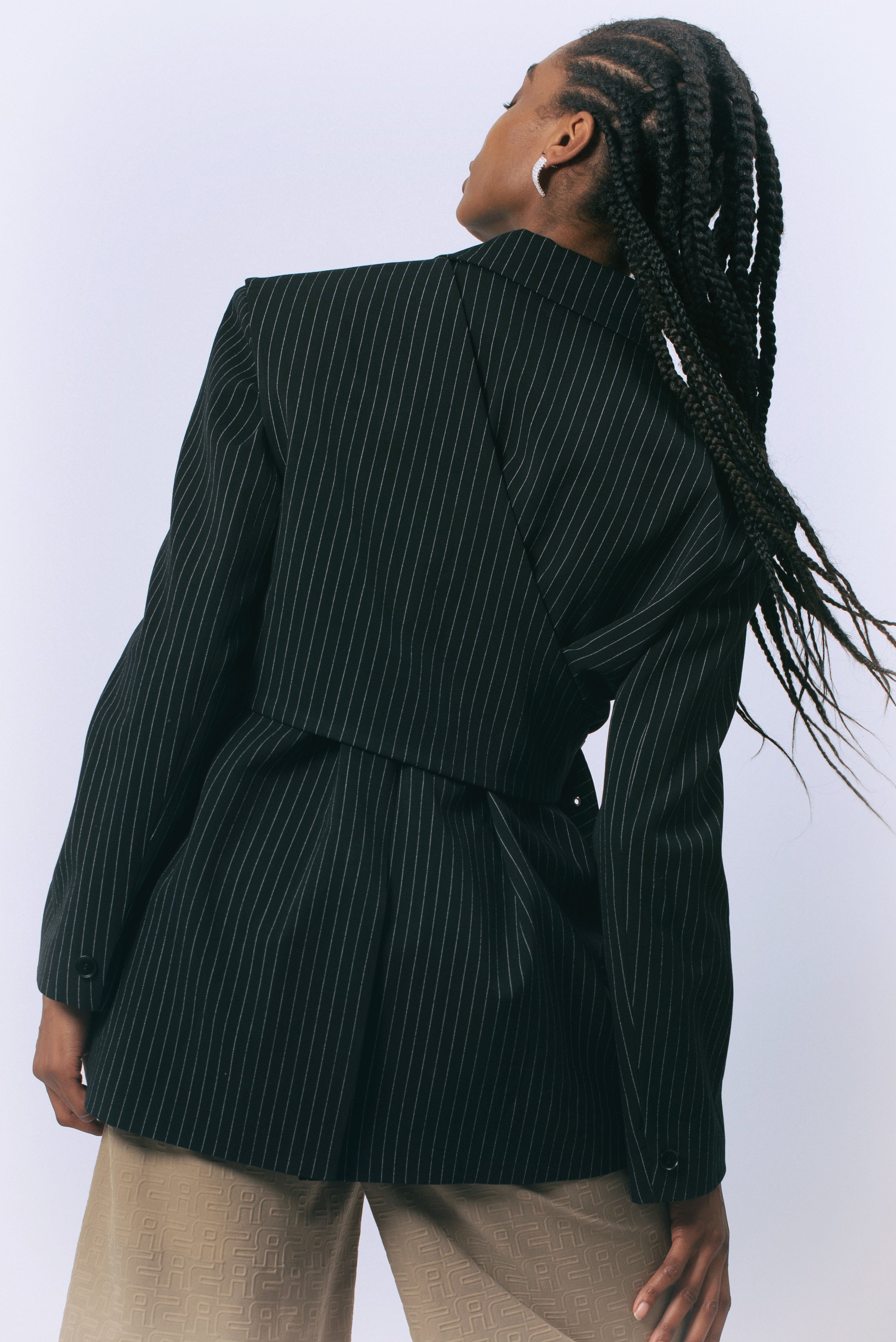 Le reussi Fashion-Luna Noir Pinstripe Blazer with a front button closure, this blazer is perfect for any sophisticated and exclusive occasion